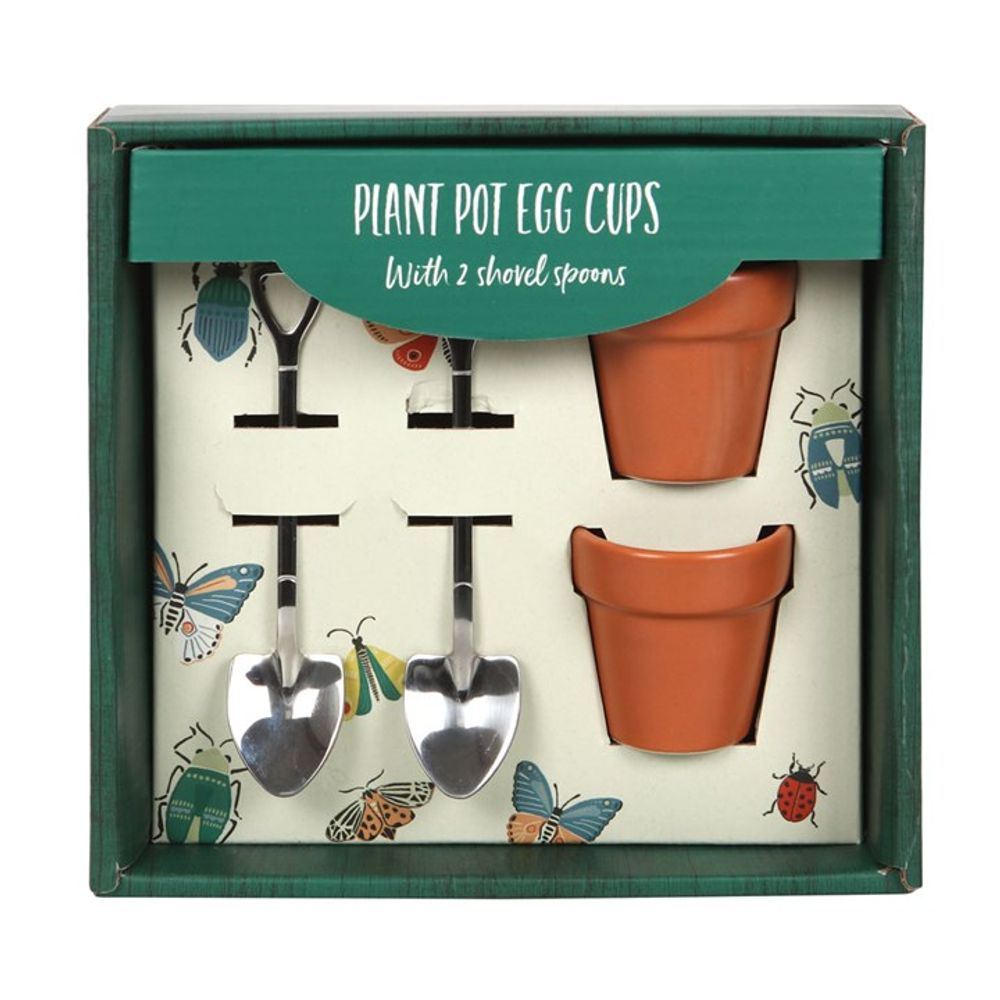 The Plant Pot Egg Cup Set with Shovel Spoons includes two charming terracotta plant pot egg cups and two shovel spoons, making it the perfect kitchen essential. The packaging is beautifully adorned with vibrant illustrations of colorful insects.