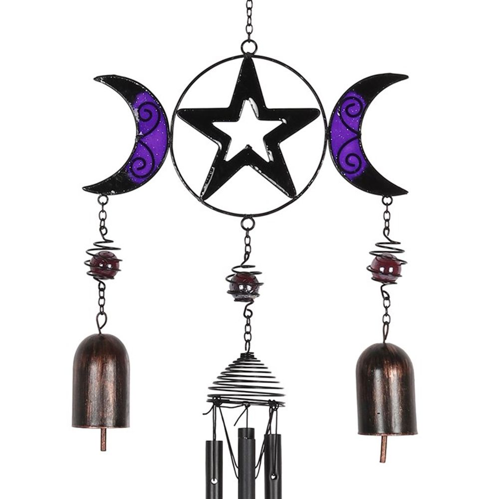 The Triple Moon Windchime with Bells features a decorative design of two crescent moons and a central five-point star, all painted in black and purple with swirling patterns. Hanging below this intricate arrangement are two metallic bells, a spiral, and several rods, creating an artistic and captivating display.