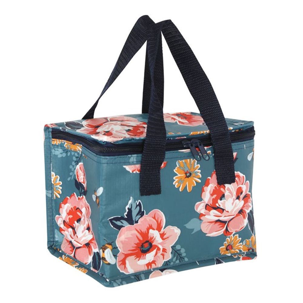 The Bee-utiful Floral Lunch Bag is an insulated square-shaped bag made from recycled plastic. It features a teal background adorned with vibrant floral designs of red, pink, and yellow flowers. The bag is complemented by black handles and a top zipper closure.