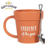 The Gardener of the Year Pot Mug and Shovel Spoon is an orange ceramic mug shaped like a plant pot, with "Gardener of the Year" inscribed on it. A miniature spade-shaped shovel teaspoon rests on the handle, featuring a "Gift of the Year 2021 Shortlisted" logo in the top left corner.