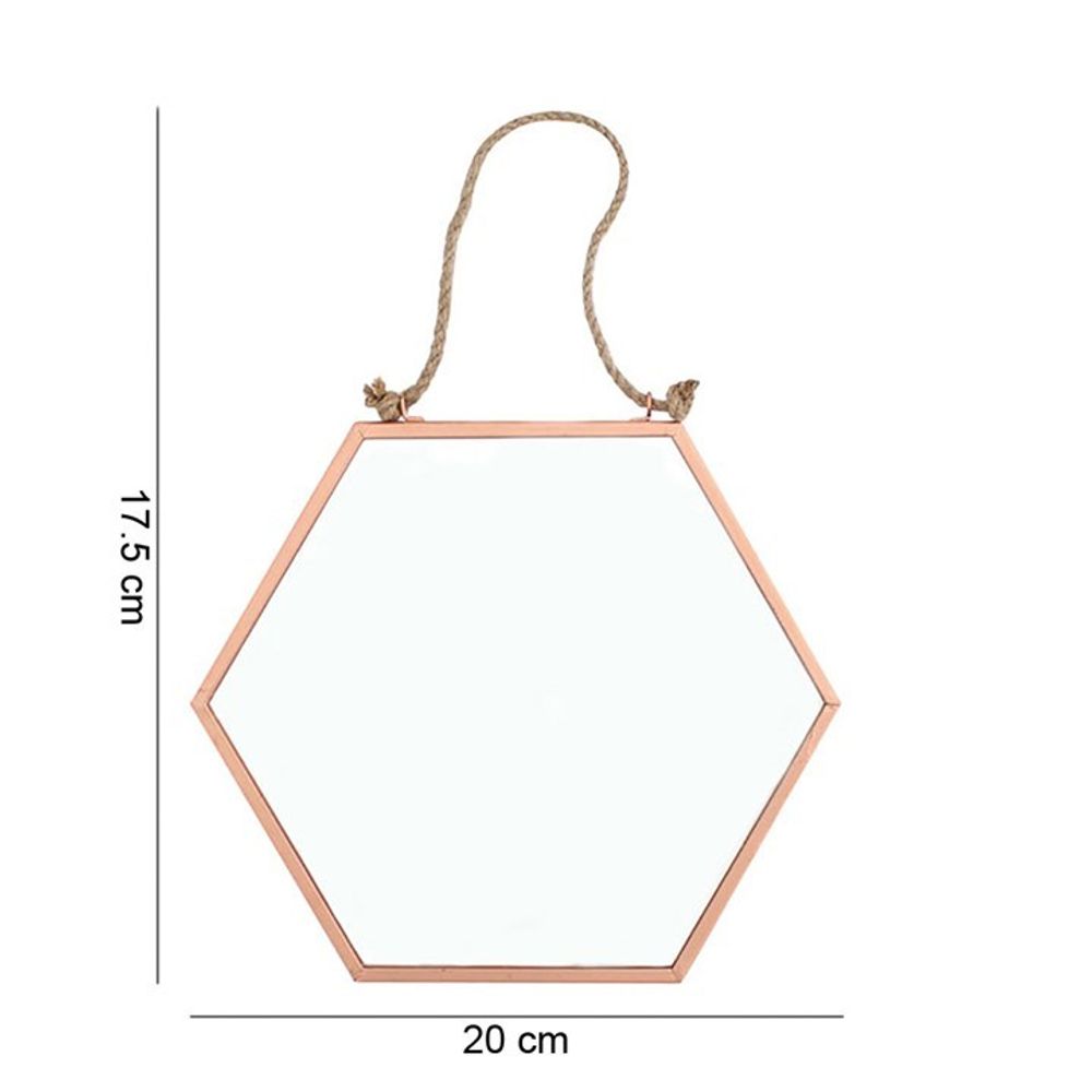 The Small Geometric Mirror showcases a hexagonal frame in a copper hue, with dimensions of 17.5 cm in height and 20 cm in width. Ideal for home decor, this compact mirror is elegantly suspended by a chic rope for easy hanging.
